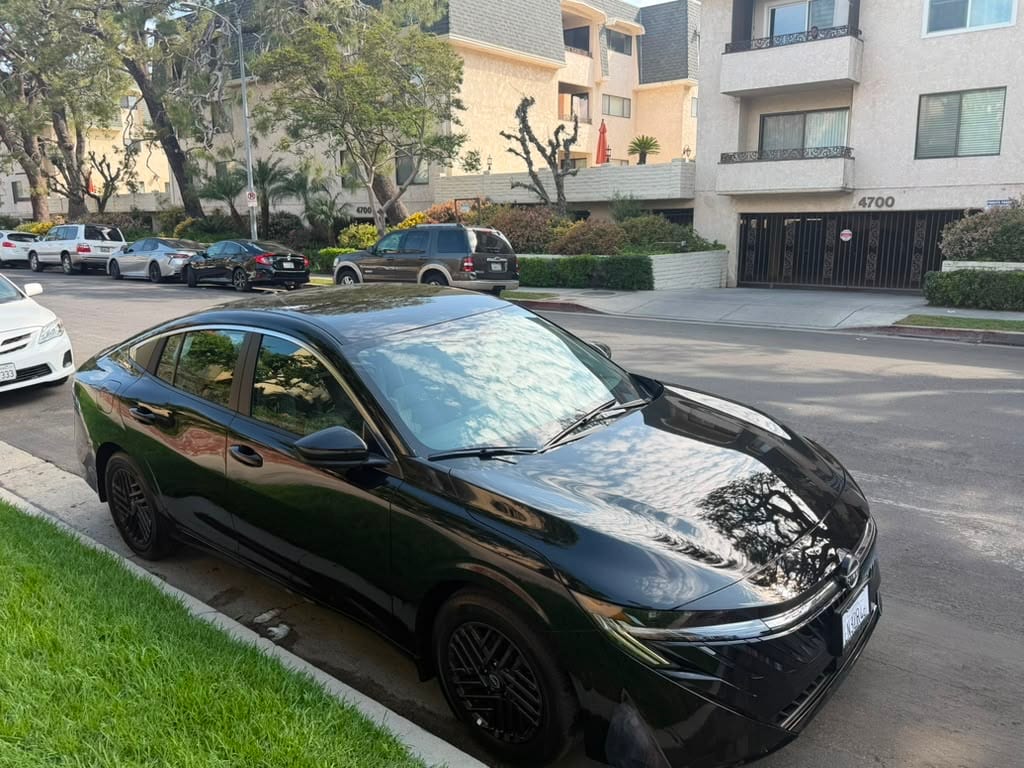 Black Nissan Sentra parked on a Los Angeles street